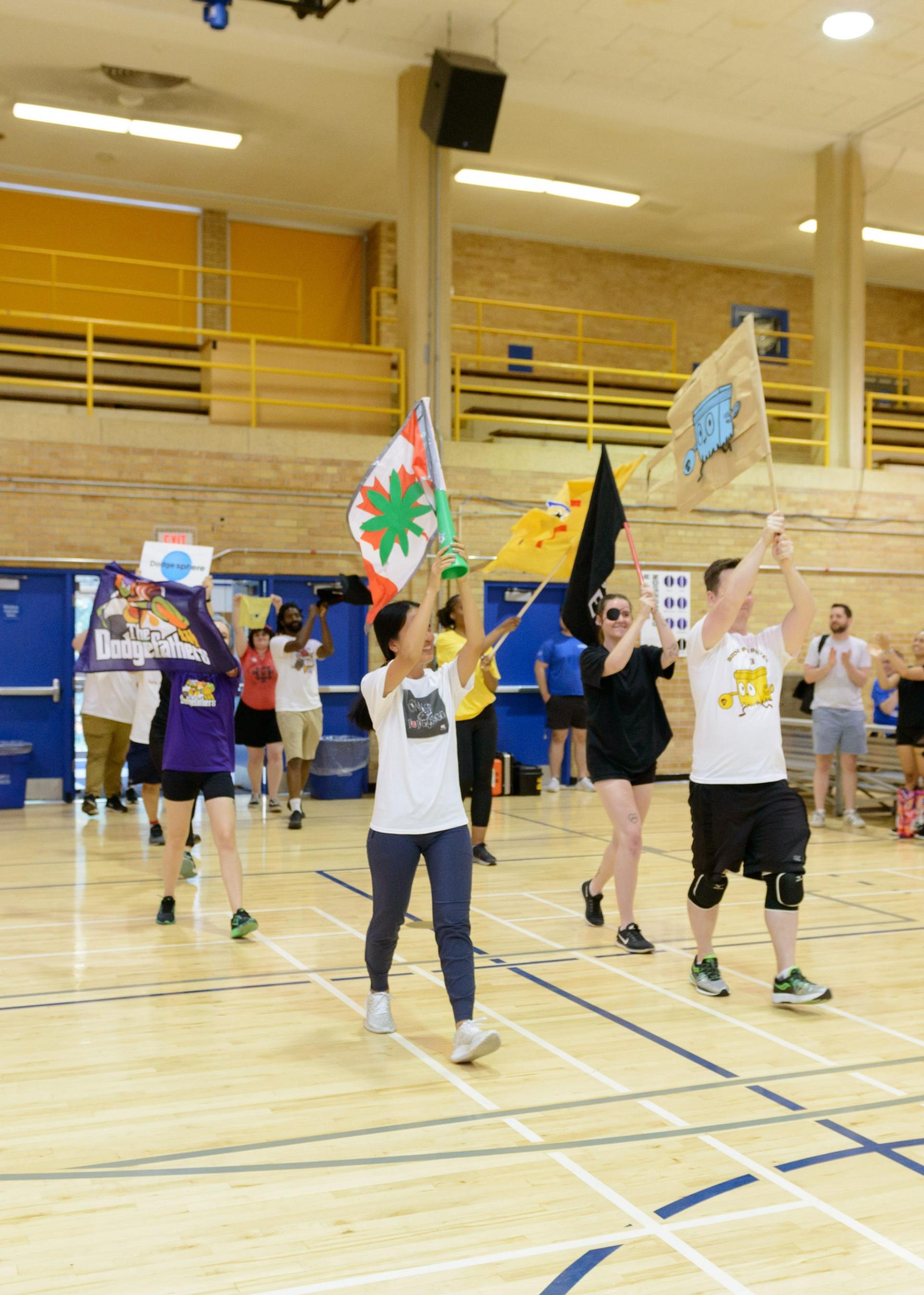 Brown Bag Films at dodge ball tournament - Players entering with flags
