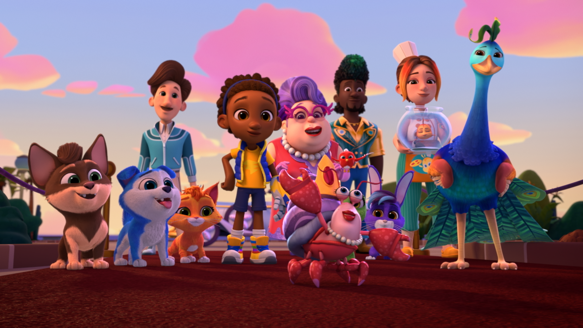 Animated group shot from RoboGobo showing the full team of animal heroes and their human friends standing together on a path at sunset. The lineup includes dogs, cats, a rabbit, a crab, and a tall peacock‑like bird, all posed confidently against a warm pink-and-gold sky, conveying teamwork and adventure.