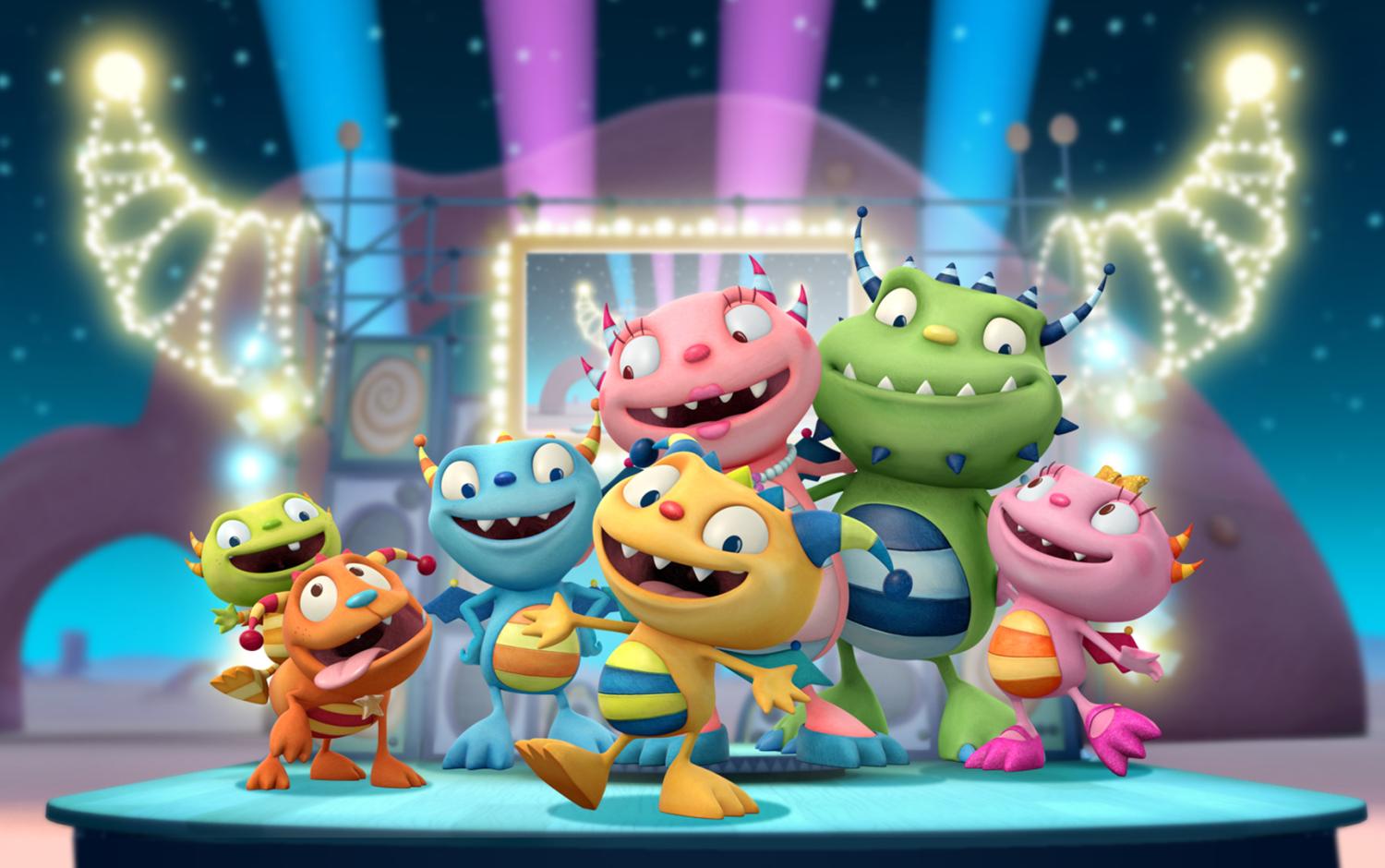 Henry and his family on a brightly lit stage