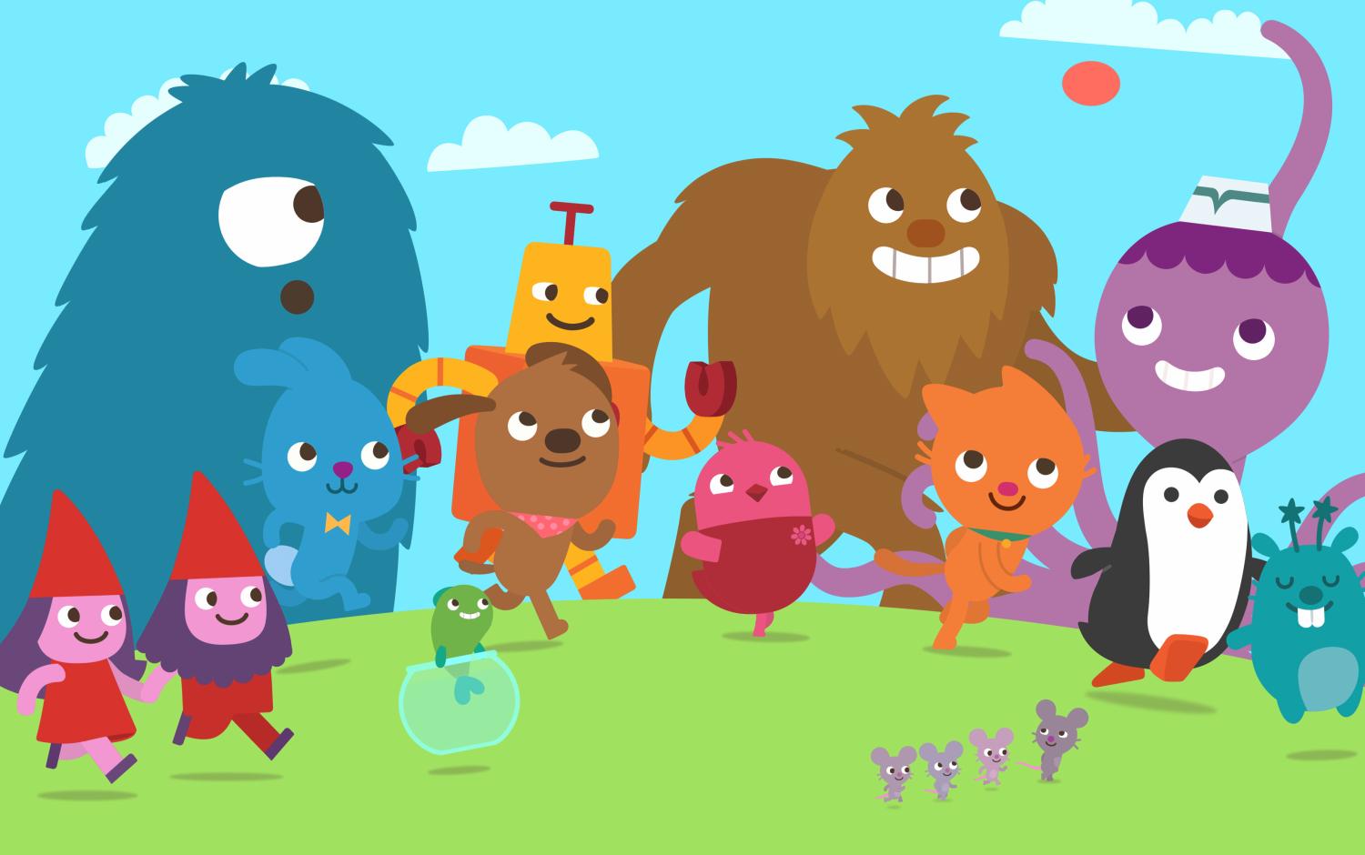 Group of Sago Mini Friends characters walking and playing on grass under a blue sky.