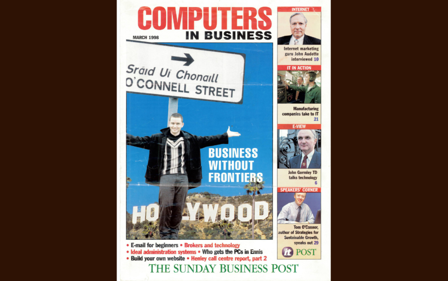 Magazine cover titled Computers in Business featuring a person holding a street sign in front of a Hollywood backdrop, with headlines and smaller images along the side.