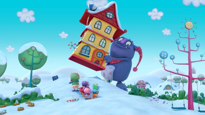A friendly giant purple monster is lifting up the Hugglemonster house
