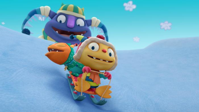 Henry and his dog sledding in the snow