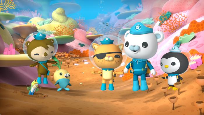 The Octonauts standing in a coral reef