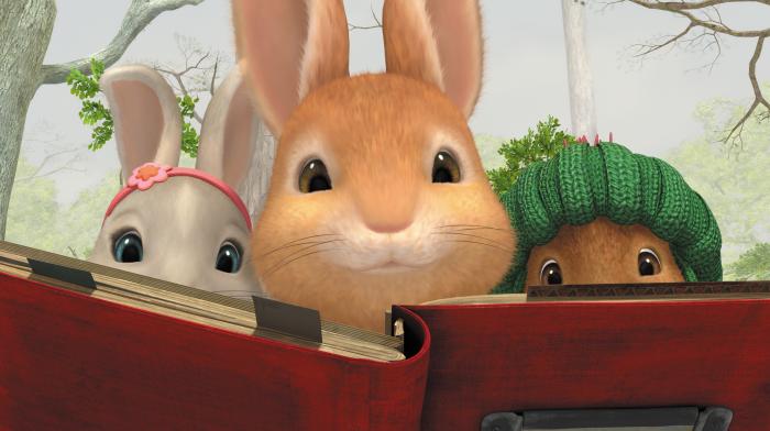 Peter, Lily and Benjamin reading a book together