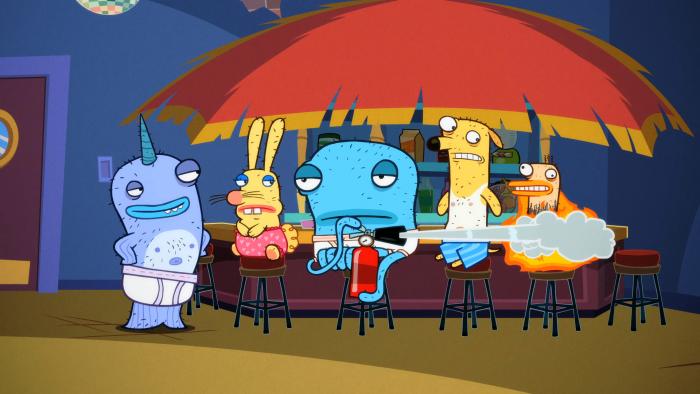 Almost Naked Animals episodic still - Blue character and yellow dog character relaxing under a beach umbrella with drinks.